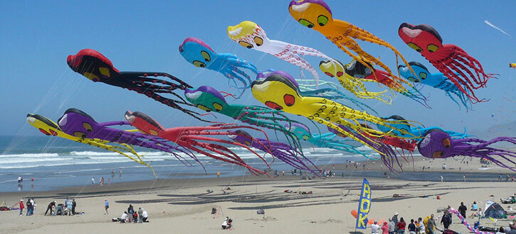 Flying kites on the beach located near our lincoln city vacation rentals